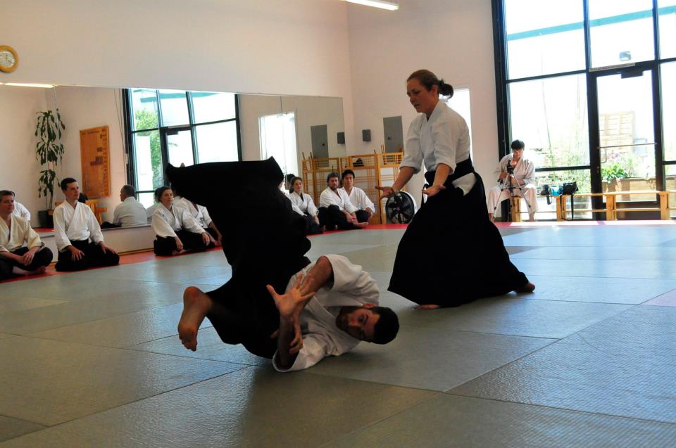 Elise Bauer demonstrating kokyu nage Aikido throw at Aikido dojo